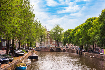Canal with boats in Amsterdam city, Netherlands