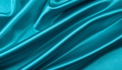 Obraz premium Teal satin fabric with soft folds and a glossy, luxurious texture