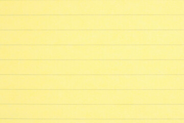 Obraz premium Yellow ruled legal pad paper background