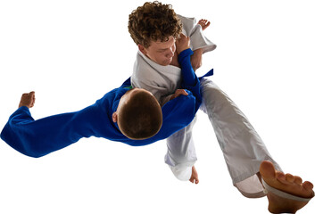 Two judo athletes in white and blue gi executing powerful airborne combat move, on transparent...