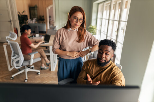 Collaborative Teamwork in a Modern Office Environment with Diverse Professionals