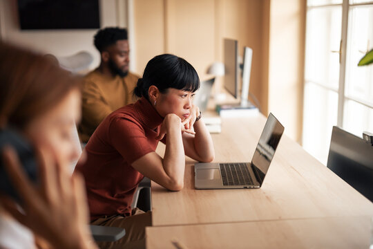 Focused Team Collaborating in a Modern Office Environment