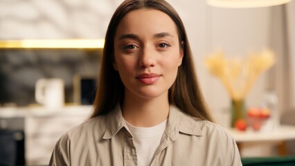 Close up Caucasian woman female smiling dreaming relaxing in apartment cozy interior living room...