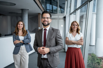 Business team smiling together in modern office building