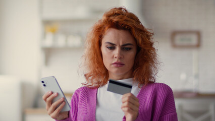 Caucasian puzzled worried girl female woman buyer try to pay online with mobile phone bank app error credit card unsuccessful transaction bank blocked money problem shopping at home with smartphone