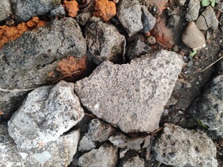 a pile of construction materials on the ground.
