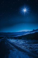 Bright Christmas star above frosty road at night. Spiritual winter landscape.  
