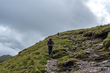 We're going up, a couple of mountaineers on a steep path to the top of the mountain.