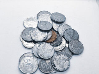 Top view of Indonesian coins — silver and a rare bronze gem.