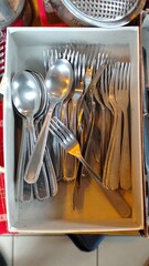 Silverware collection nestled in a box showcasing the beauty of everyday dining tools during a...