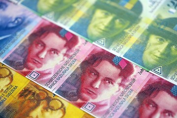 Swiss franc banknotes. The current francs money bills lies on table in big amount close up