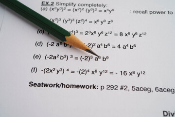 Pencil on mathematic formula exercise test paper in education school.