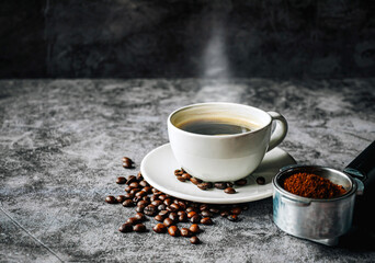 ground coffee in Portafilter and beans with coffee cup ,Top view Espresso coffee cup aromatic and making equipment