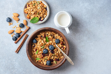 Homemade dried granola with nuts and berries in bowl. Top view copy space