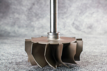 Close up Turbocharger rotor Shaft, impeller Shaft wheel turbocharger, turbine Shaft turbocharger on...
