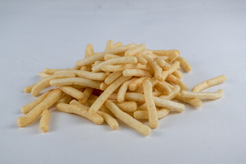 Snack stick corn, Crispy and salty Snack with yellow color isolated on white background.