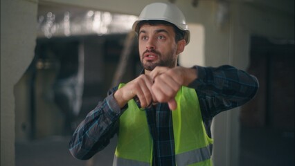 Angry Caucasian man talking shouting scream on walkie talkie radio device furious male contractor...