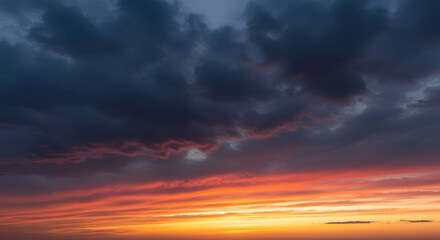 Fiery Dawn Witness the Majestic interplay of Colors at Sunrise, where skies are painted with vibrant hues and the sun's radiant light transforms the atmosphere. 