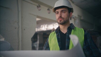 Serious Caucasian contractor handyman architect worker look blueprint man foreman working builder...