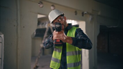 POV rotary drill busy Caucasian worker repairman builder handyman drilling man contractor holding...
