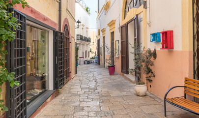 A narrow cobblestone street in the historic center of Gallipoli, Puglia, Italy