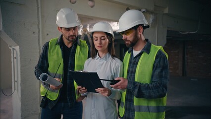 Professional Caucasian colleagues team discussing building in construction guys technicians...