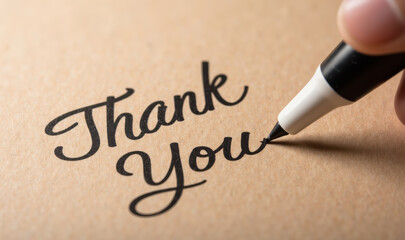Thank you note written with marker on brown paper, expressing gratitude and appreciation. elegant script adds personal touch to message
