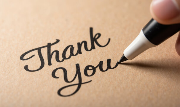 Thank you note written with marker on brown paper, expressing gratitude and appreciation. elegant script adds personal touch to message