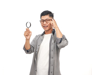 Young Man with Magnifying Glass: Thinking, Analyzing, and Inspecting for Details