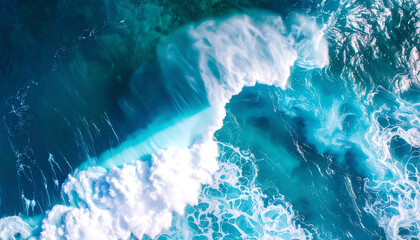A dynamic aerial shot of a large, powerful ocean wave breaking in the deep blue