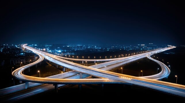 Night traffic interchange concept, aerial view of busy highway junction with neon lights and car trails, for Advertise, for banner, with copy space