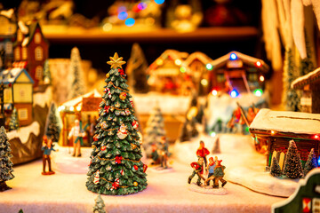 Hand‑crafted Christmas village scene at a market stall for festive storytelling concept