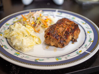 grilled pork fillet with potatoes and salad