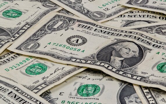 Pile of used US dollars partial cash bills money closeup finance economy concept Houston, Texas USA 07-07-2025.	