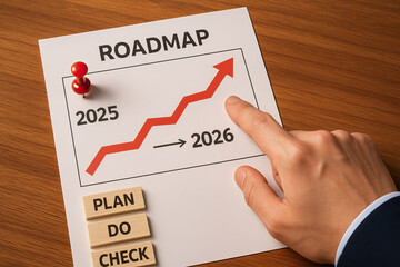 Roadmap concept with red upward arrow showing growth from 2025 to 2026, hand pointing at chart, and wooden blocks with plan, do, check words on wooden table