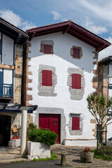 house with red shutters in the town of Ainhoa in the Spanish Basque Country with the typical Basque letters everywhere