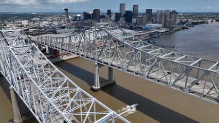 New Orleans, Louisiana city skyline business and commerce beside the Mississippi River with office towers and parks on summer day during a heat wave