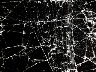 the surface texture of shattered glass with intricate cracks