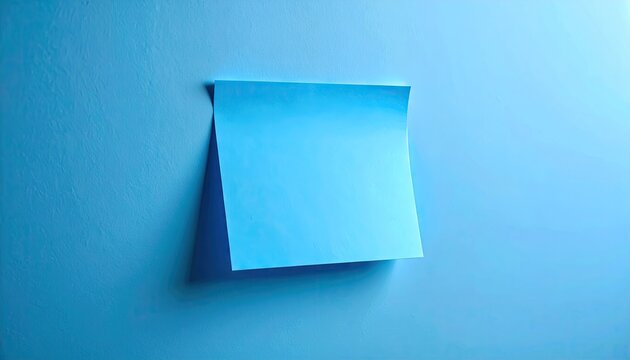 Blank blue sticky note on blue background