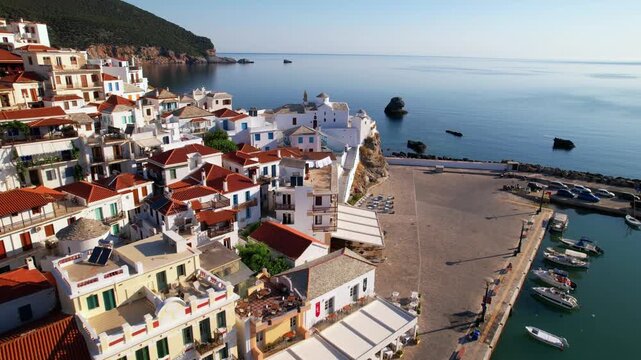 Cinematic Aerial Flyover of Panagitsa of Pyrgos Church, Iconic White Chapel on a Cliff, Skopelos Chora, Greece