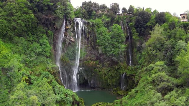 The spectacular waterfall at Marmore Falls, seen from a drone: the melted water from the glacier begins its journey toward the sea after the spring thaw.  drought aridity 