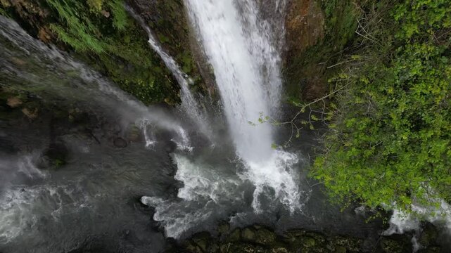 The spectacular waterfall at Marmore Falls, seen from a drone: the melted water from the glacier begins its journey toward the sea after the spring thaw.  drought aridity 