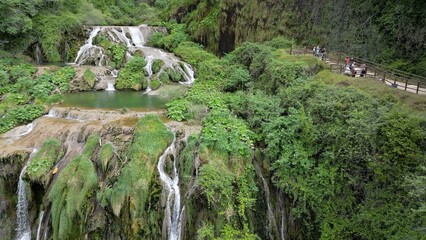 The spectacular waterfall at Marmore Falls, seen from a drone: the melted water from the glacier begins its journey toward the sea after the spring thaw.  drought aridity 