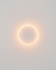 Soft inner glow around circular object radiating warm light on plain white background