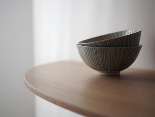 Stack of ceramic bowls on wooden table minimalist kitchenware home decor product photography