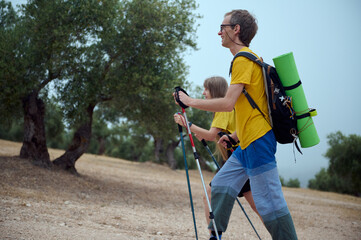 Young Couple Trekking Through Scenic Mountains with Hiking Gear
