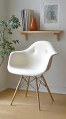 Mid century modern white armchair with wooden dowel legs and decorative shelf