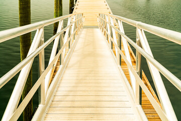 Wooden boat ramp with metal railing
