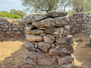 Remains of prehistoric stone huts in the Nuragic village of Serra Orrios, Sardinia
