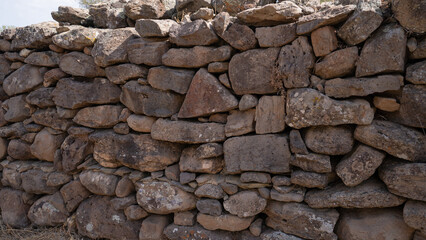 Remains of prehistoric stone huts in the Nuragic village of Serra Orrios, Sardinia
